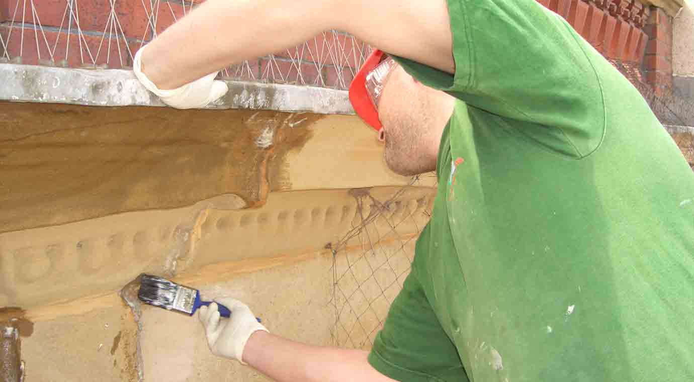 A man applying Stormdry as a stone waterproofer