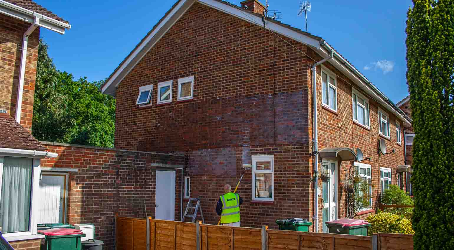 Stormdry being applied with a roller to waterproof brickwork